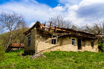 Fototapeta na wymiar Abandoned old houses in villages in the south-west of Ukraine