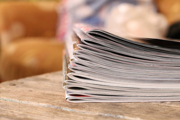 Magazines on the wooden table 