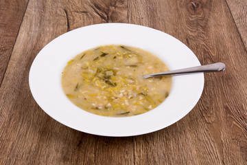 Vegetable soup on a wooden table