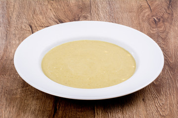 Vegetable soup on a wooden table