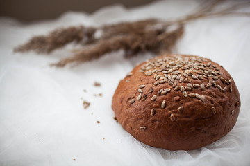 black round bread lies on a white table