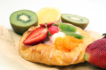 danish pastry with strawberry, kiwi and tangarine