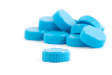 Plastic bottle cups isolated on white background