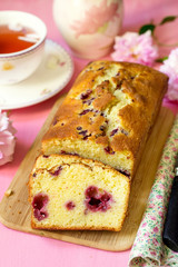 Sweet cake with fruit and berries on pink background