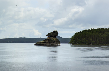 Obraz premium Borovoe lake and stone sculprure jumbaktas, Burabay National park in Northern Kazakhstan.