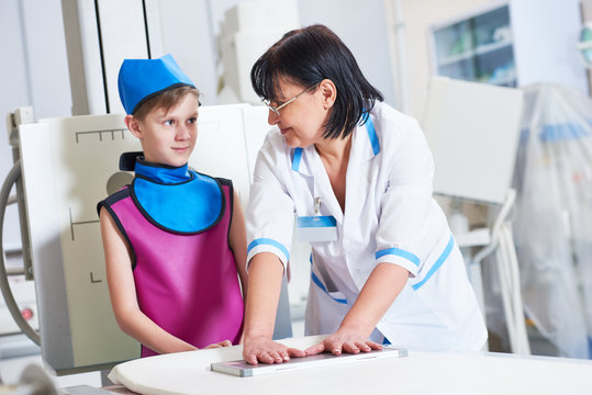 Nurse assistant with little boy preparing or x-ray radiography