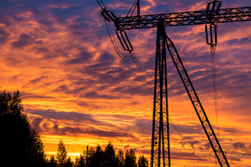 Power line support against a fantastic sky background