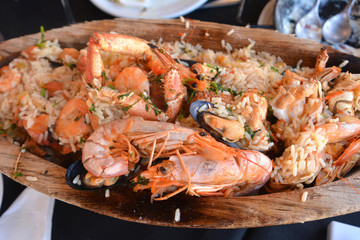 A huge platter of seafood. Very tasty food on a light background.