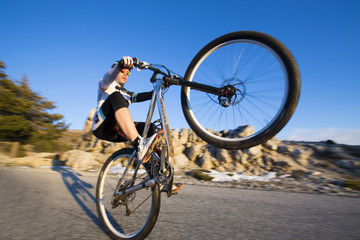 Fototapeta na wymiar Cyclist man riding mountain bike on a mountain road