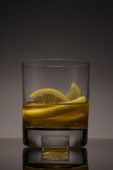 Whiskey with lemons in a a glass