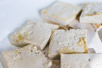 Tofu frying in ceramic pan