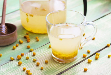 Hot berry drink - sea buckthorn tea in a glass