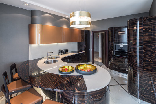 Contemporary kitchen interior. Wooden furniture. Luxury style.