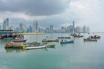 Panama city fishing boats anchored with skyscrapers buildings, Pacific coast, Central America