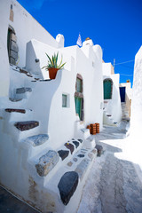 Narrow neighborhood at the old traditional village of Emporio, Santorini, Greece.