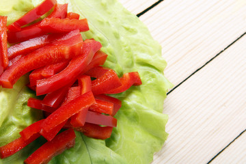 Chopped sweet pepper a wooden background