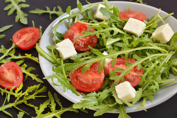 tomatoes with fresh arugula and mozzarella