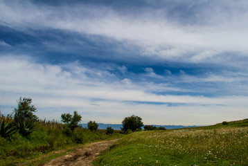 Fototapeta na wymiar Green hill with blue sky