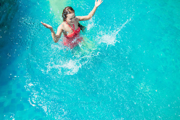 Asia Women swim in the pool