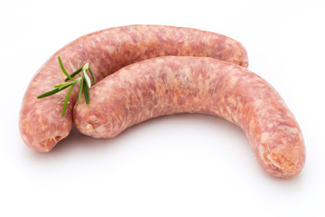 Raw sausage with parsley leaf isolated on white background.