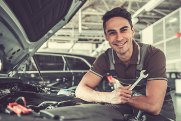 Handsome auto service worker