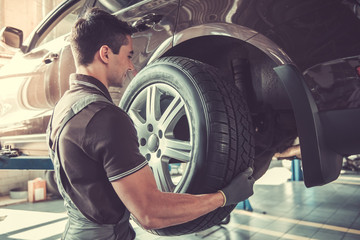 Handsome auto service worker