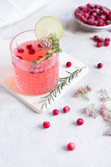 summer homemade juice with lime and berries on stone table background