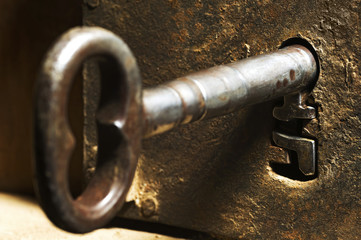 keyhole old with antique key on a wooden vintage  door ,  selective focus