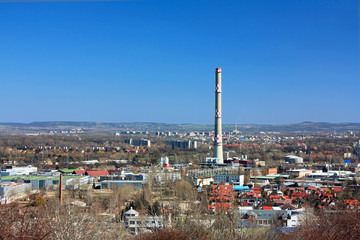 Chimney industrial area with houses and blue sky