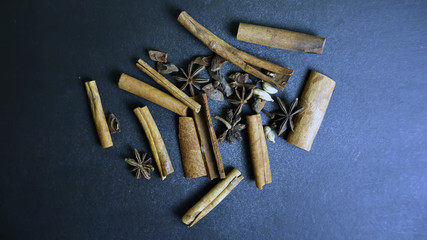 cinnamon and star anise, on black background