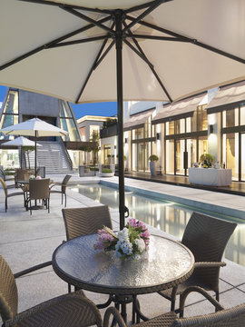 Patio Table And Chairs With Umbrella By Pool