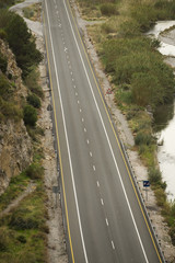 Fototapeta premium Lines and lane markings on the on asphalt road surface texture