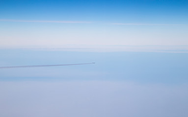 Airplane in the sky far away. Blue, clean sky.