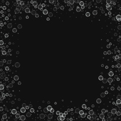 Soap bubbles. Chaotic border with soap bubbles on black background. Vector illustration.