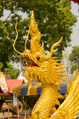 Fototapeta premium Beautiful gold dragon statue at Wat Mai Kham Wan temple, Phichit,Thailand.