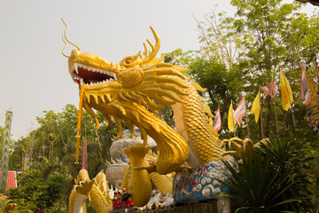 Beautiful gold dragon statue at Wat Mai Kham Wan temple, Phichit,Thailand.