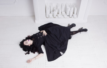 Sensual gothic woman in a long gorgeous black dress