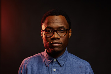attractive young black male studio red light glow serious face