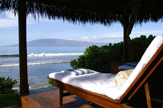 Lounge chair on deck overlooking ocean, USA, Hawaii, Maui