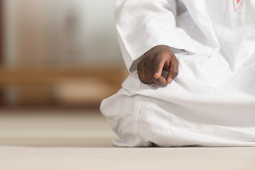 Close-Up Of Male Hands Praying