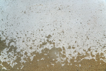 rain drop on road surface with dry and wet area