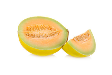 portion cut fresh yellow melon with stem on white background
