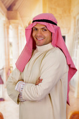 smiling arabian man with arms crossed