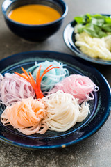 noodles with fish curry sauce and vegetable