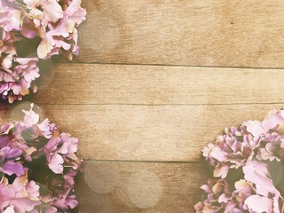 wood background with flowers bouquet vintage filter color