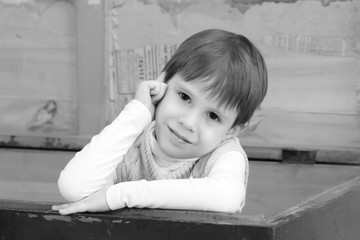 Fototapeta premium The little boy hid in an old chest.
