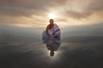 Monk novice looks into his reflection
