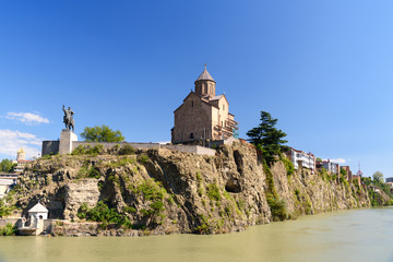 Fototapeta na wymiar Metekhi Church and Vakhtang Gorgasali monumen in Tbilisi, Georgia