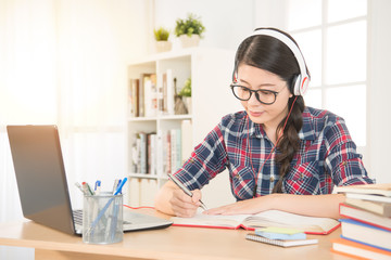 student learning on line with headphones