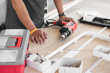 electrician working on design and installing circuit breakers